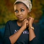 A woman poses with confidence.